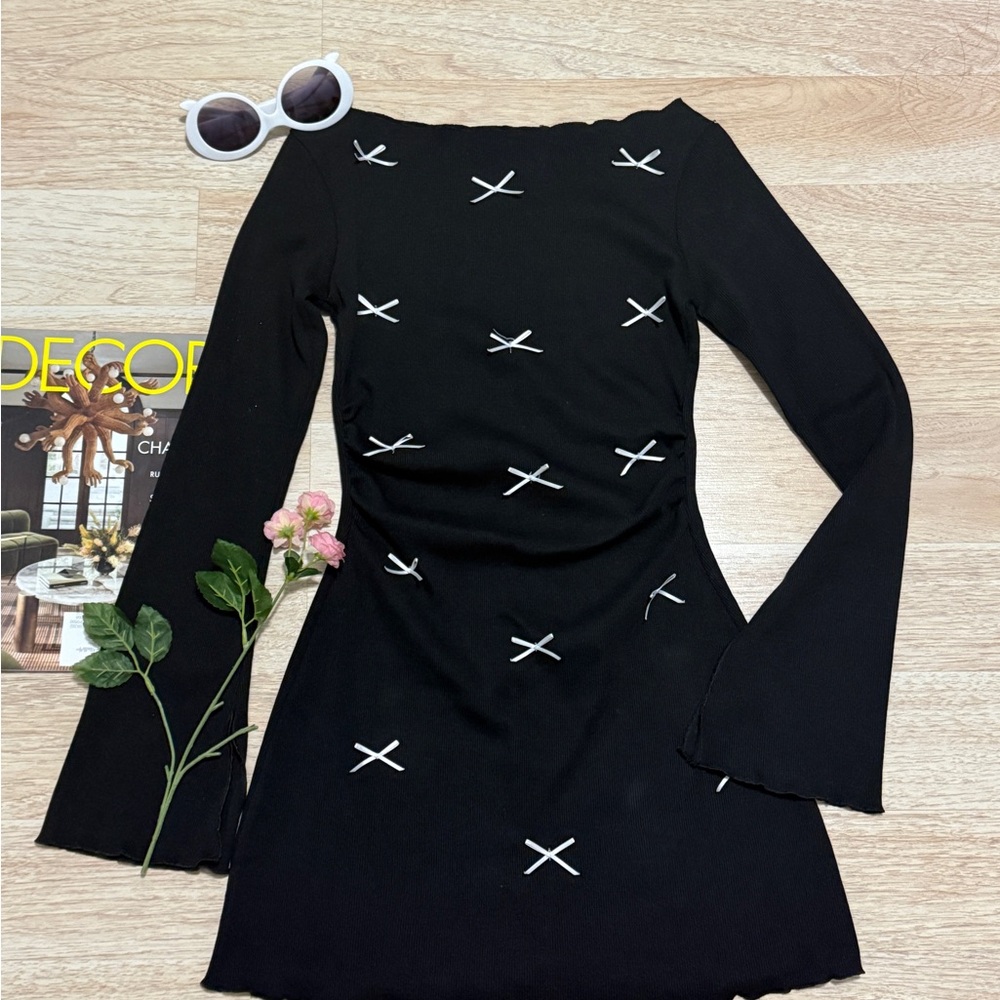 Black Vibes mini dress with white cross stitching